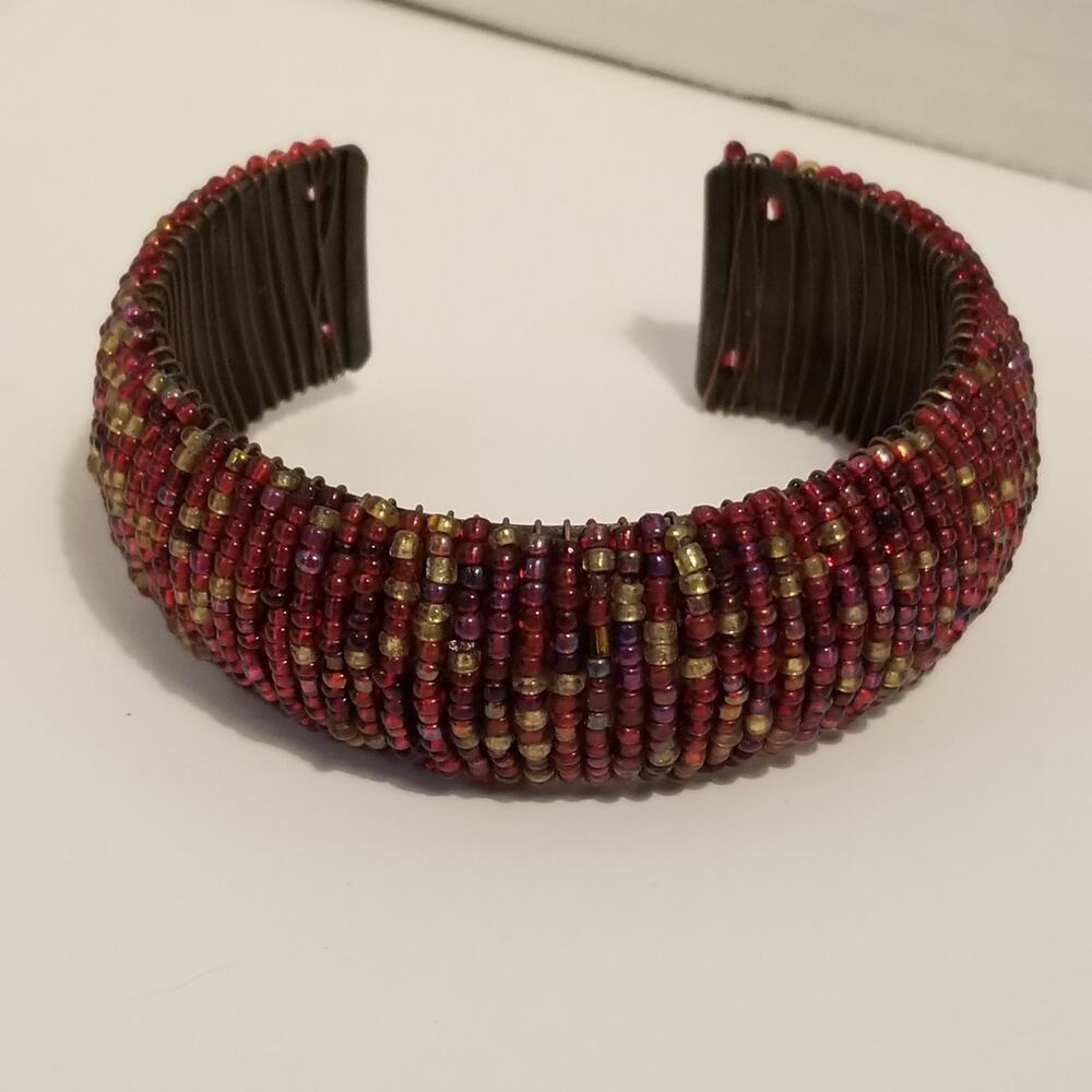 Gold and red colored seed beads wired cuff bracelet two and one half inches